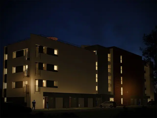 Wizualizacja budynku mieszkalnego nocą z oświetlonymi oknami elewacji